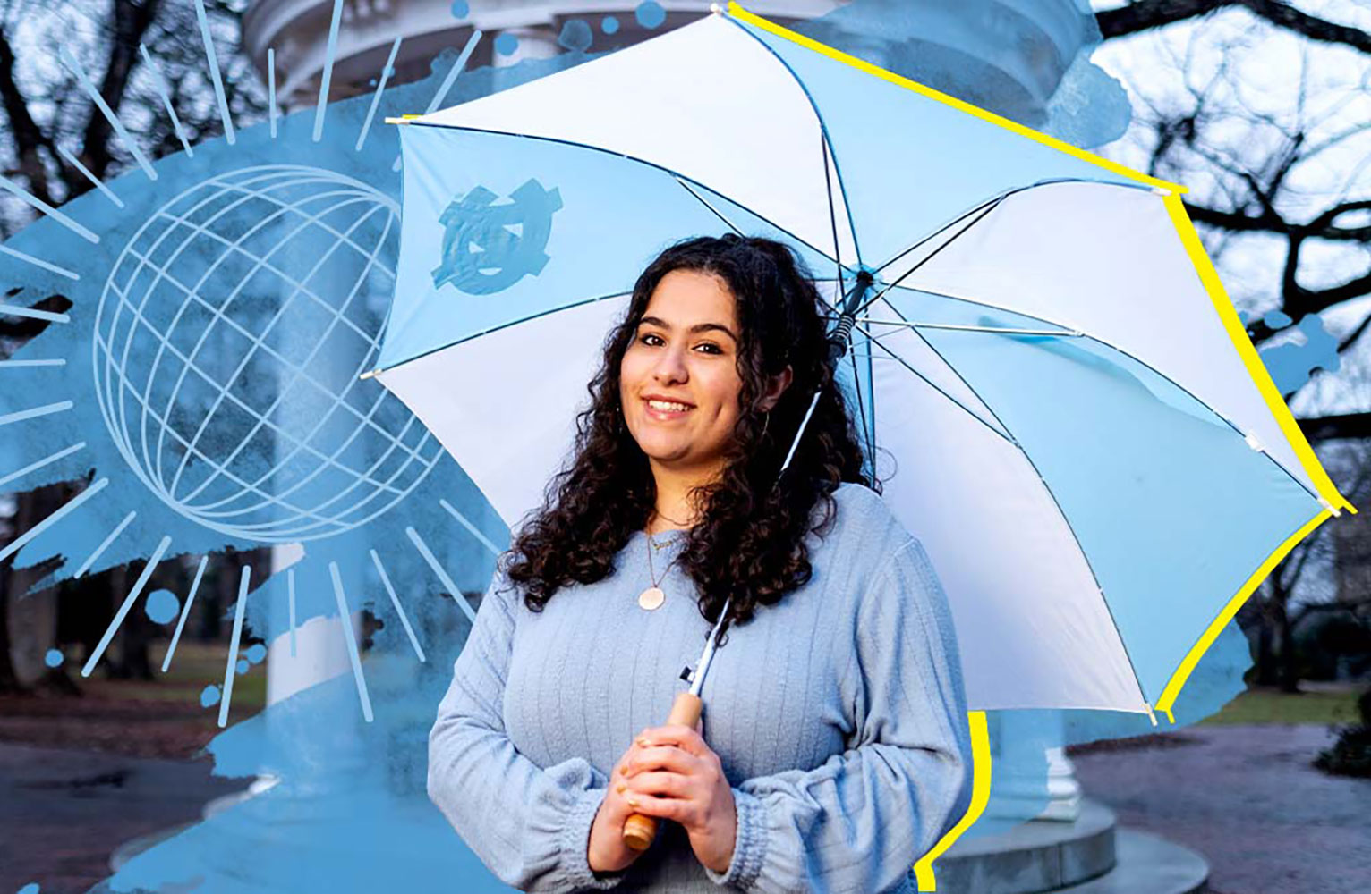 Dalal holding a UNC branded umbrella