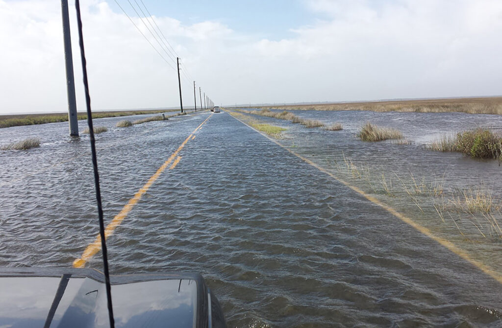 Flooding on the coastal plains swamps a highway