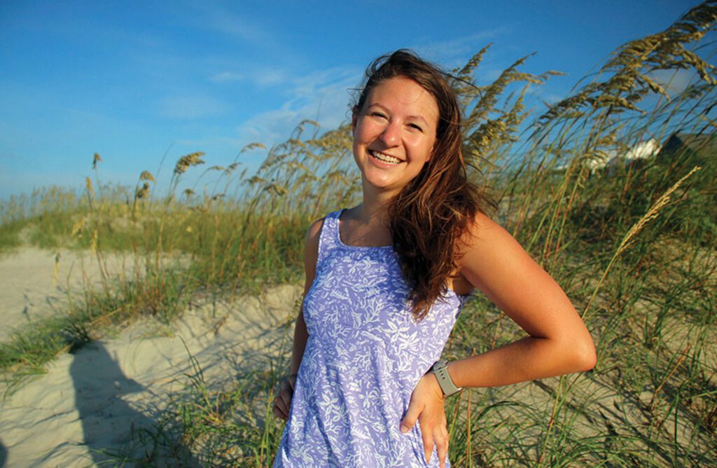 Atencio stands on the shoreline