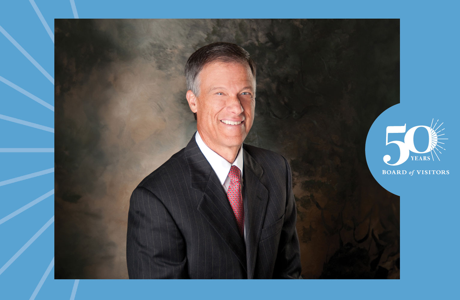 A portrait of Rick Margerison surrounded by a decorative Tar Heel blue frame that says 50 Years Board of Visitors