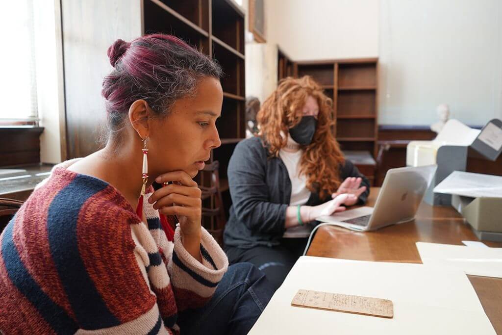 Rhiannon Giddens and Callie Beattie explore the archives at Wilson Library. (Photo by Taylor Barrett)