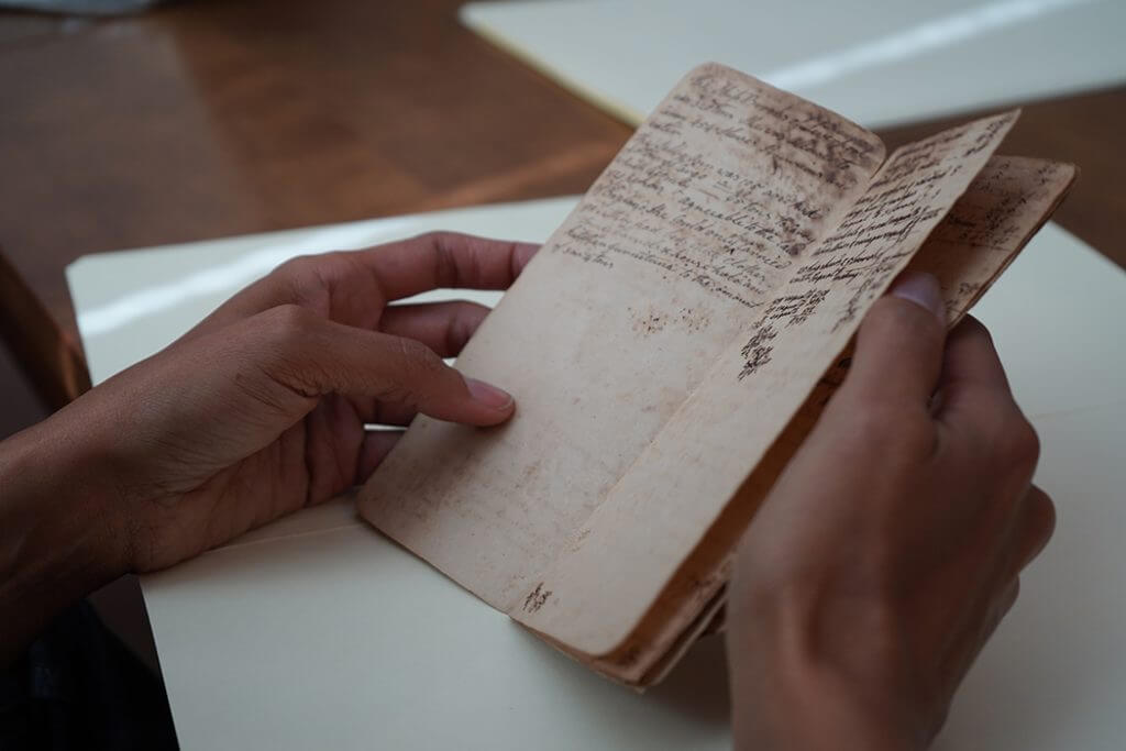 A small account book with expenses belonging to Phineas Nixon while on the voyage of the Sally Ann from Beaufort, N.C. (photo by Taylor Barrett)