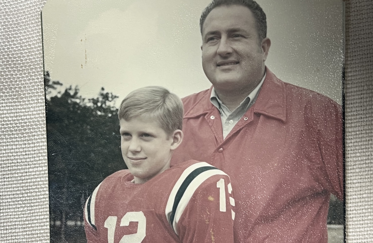 Thad Eure Jr. and Thad Eure III posing for a youth football photo