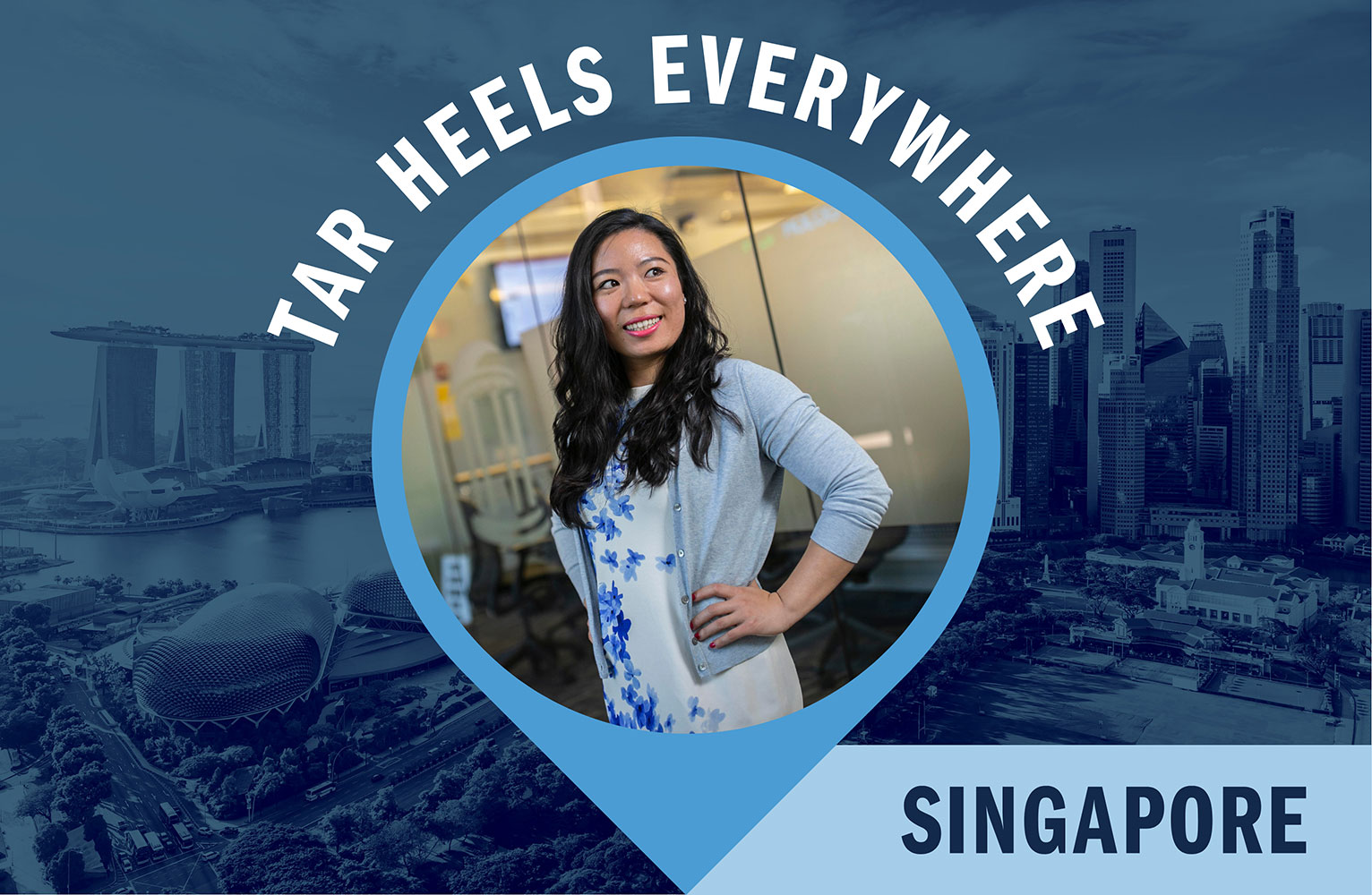 A woman stands confidently with her hand on her hip, smiling in an office setting. She is featured within a map pin graphic over a blue-tinted background of the Singapore skyline, including Marina Bay Sands. Text reads "Tar Heels Everywhere" and "Singapore."
