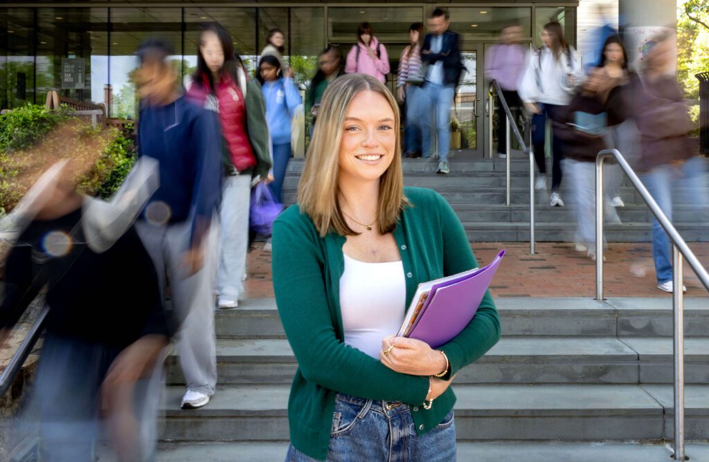 Caroline Robinson stands outside the FedEx Global Education Center at UNC-Chapel Hill.
